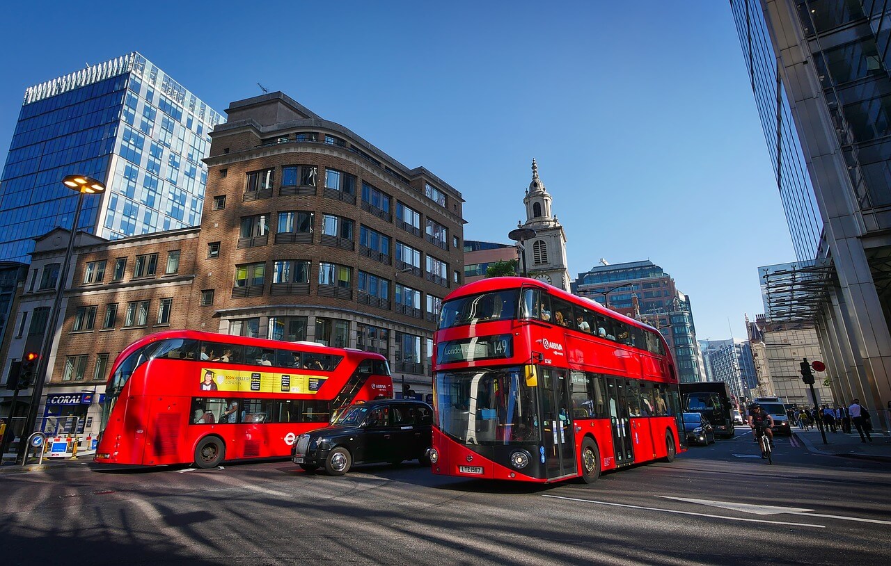 image of double decker busses in London