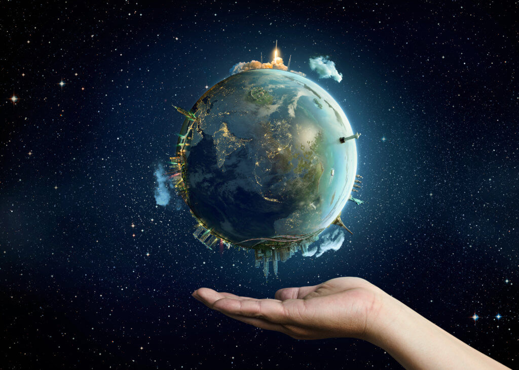 Alt: Planet earth on a palm. Elements of this image furnished by NASA