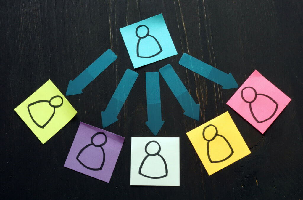 Delegation concept. Silhouettes drawn on sheets and arrows. stock photo