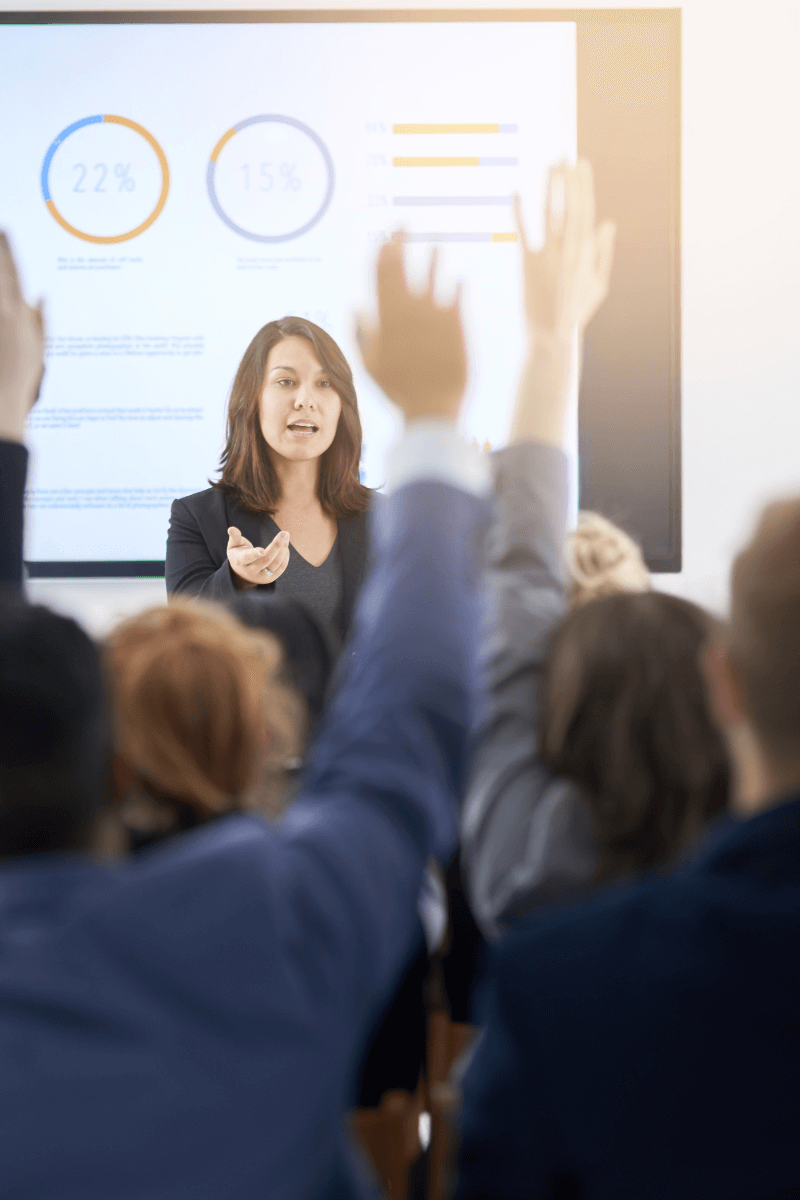 classroom 800x1200 Image of a person asking their class a question